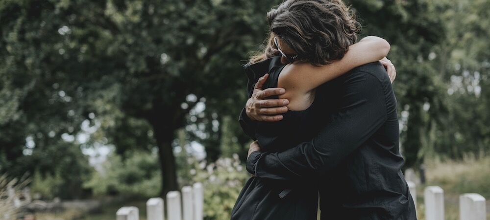 husband consoling wife after wrongful death